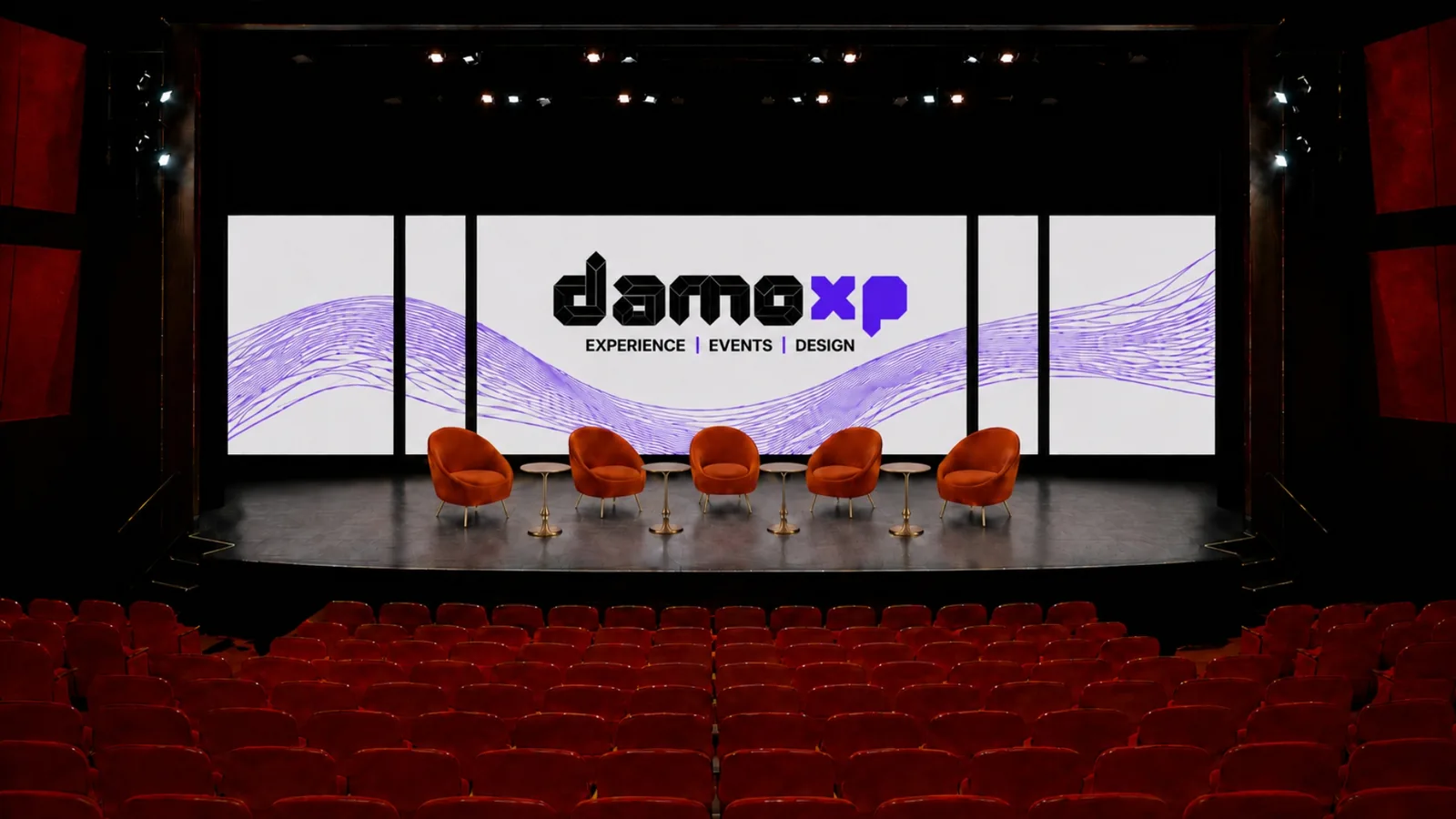 DamoXP panel discussion stage with branded screen backdrop